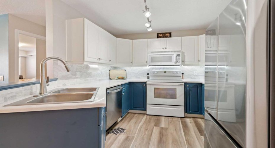 Bright Updated Kitchen with Quartz counters & new dishwasher.