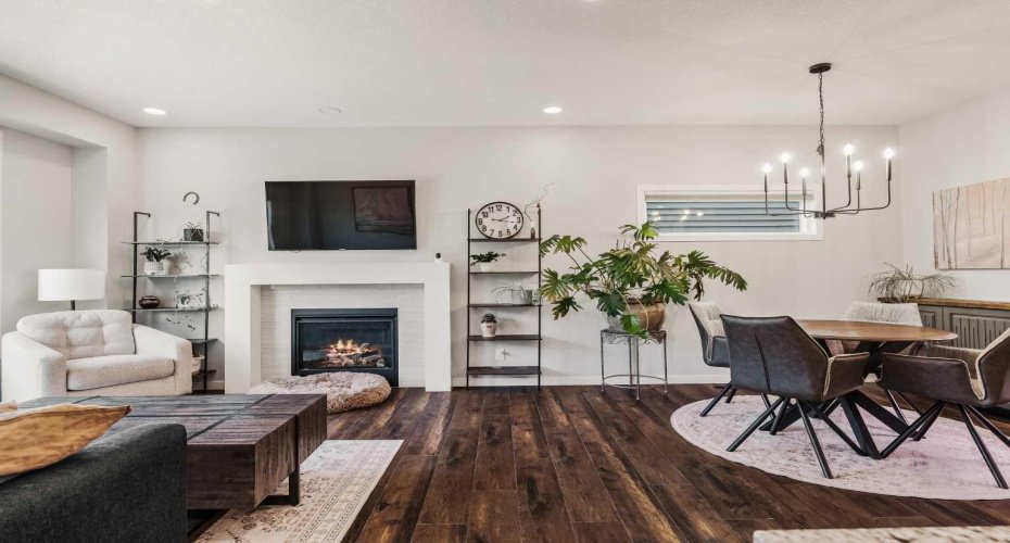 Beautiful living and dining areas with cozy fireplace