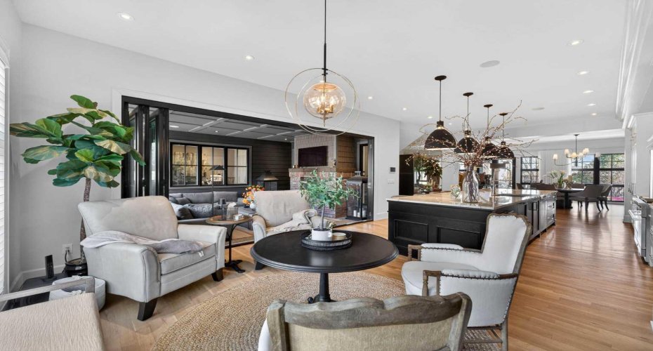 Open-concept main level with 10-foot ceilings and site-finished white oak throughout.