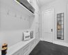 Organized mudroom with custom built-ins — designed to accommodate a busy family.