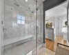 Marble steam shower with bench seating — hotel-level luxury in this Altadore home.