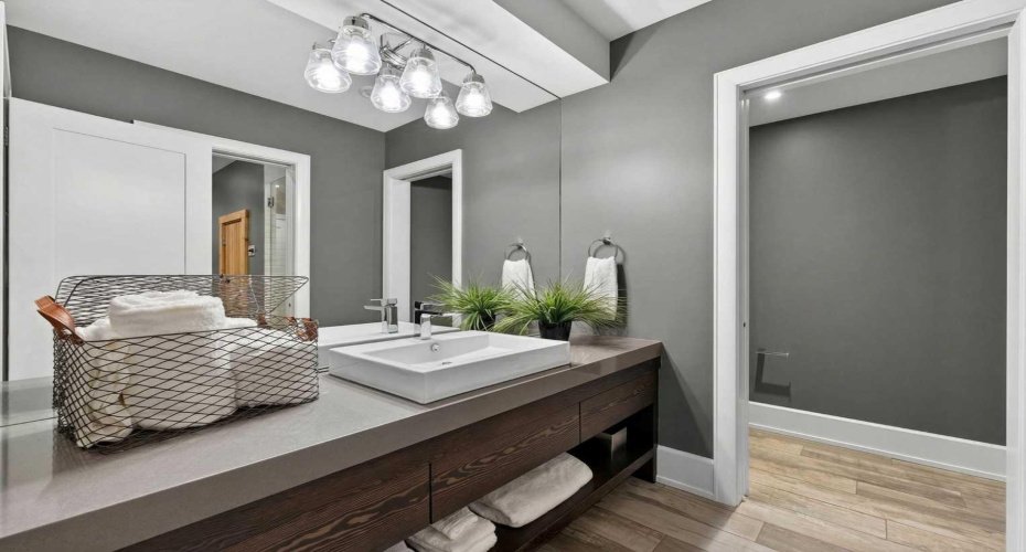 Fourth full bathroom with shower and sauna access — wellness and convenience on the lower level.