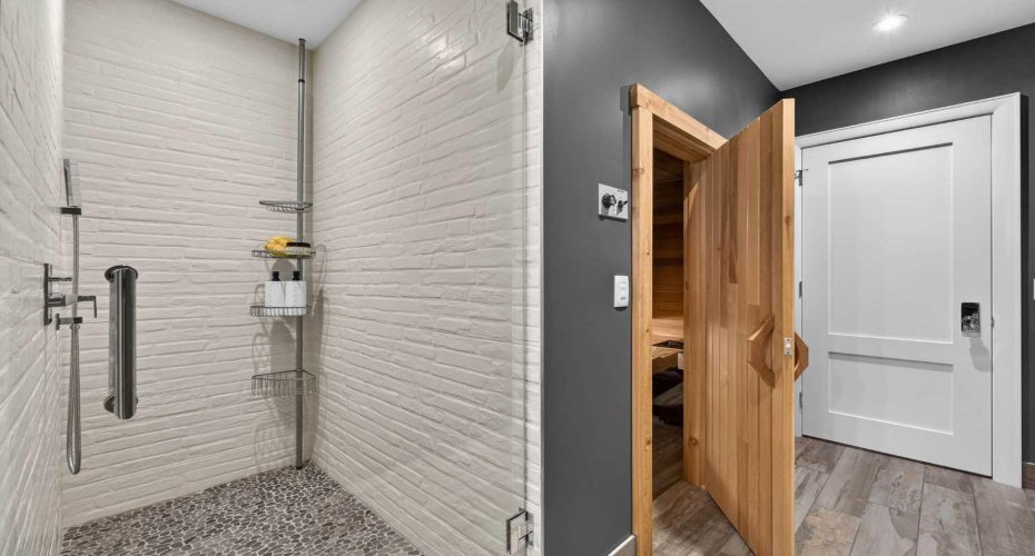 Nordic spa bathroom with sauna access — wellness living in the comfort of home.