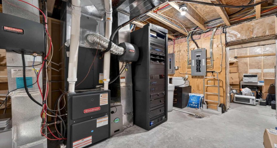 Control4 automation stack, water softener, and filtration system — the smart tech behind this home.