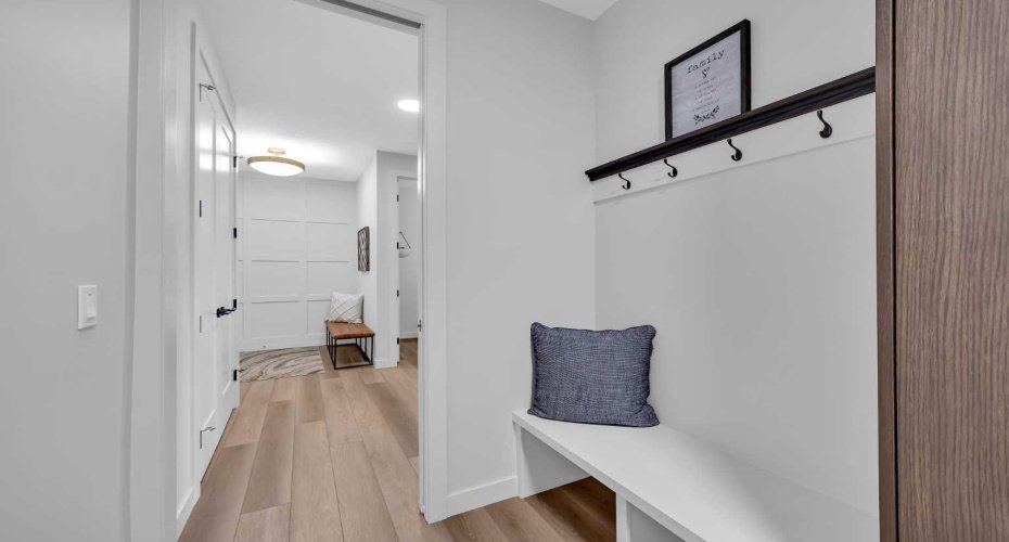 Thoughtfully designed built-in bench with matching coat hooks