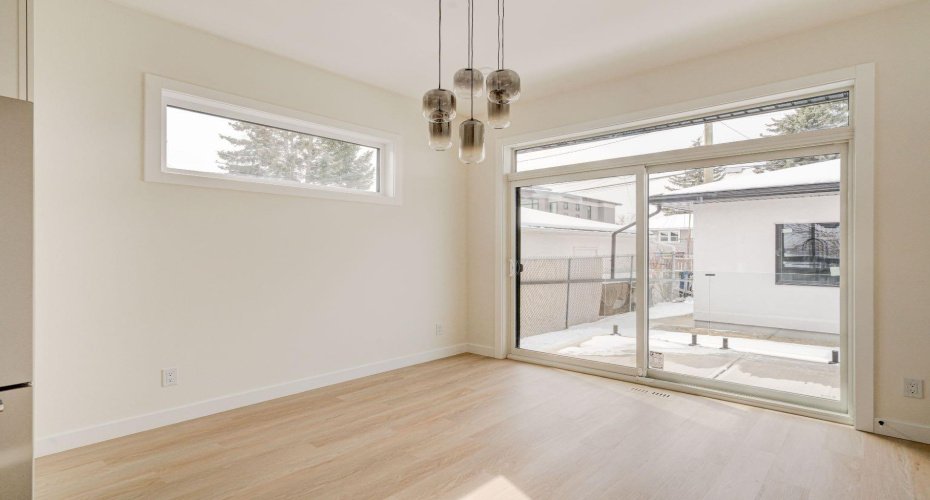 Dining Room with Direct Access to Backyard and Deck with Glass Railings