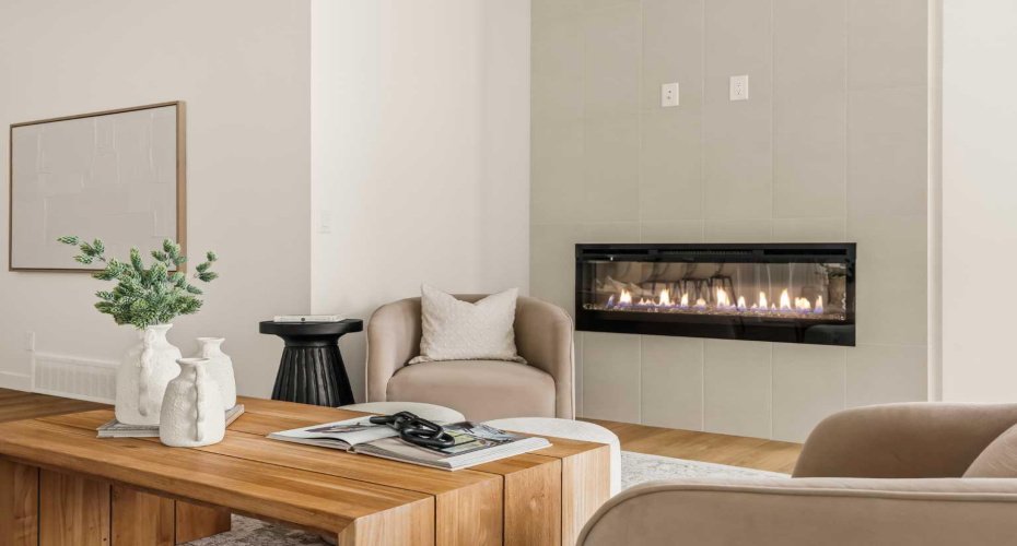 Central electric fireplace with tile surround.