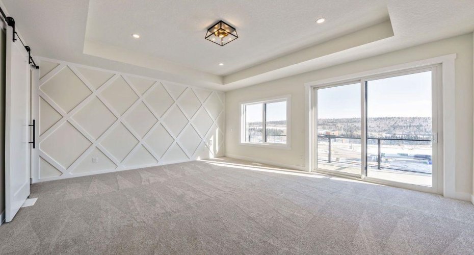 Master bedroom with muted feature wall