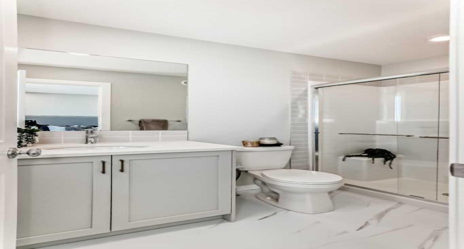Main Floor Full Bath • PLEASE NOTE: Photos are of a DIFFERENT Spec Home of the same model – fit and finish may differ. Interior selections and floorplans shown in photos.