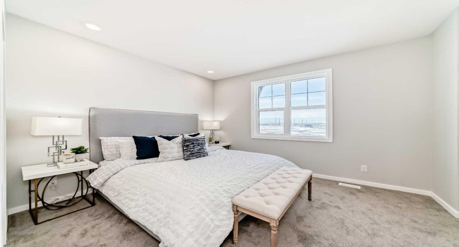 Master Bedroom • PLEASE NOTE: Photos are of a DIFFERENT Spec Home of the same model – fit and finish may differ. Interior selections and floorplans shown in photos.