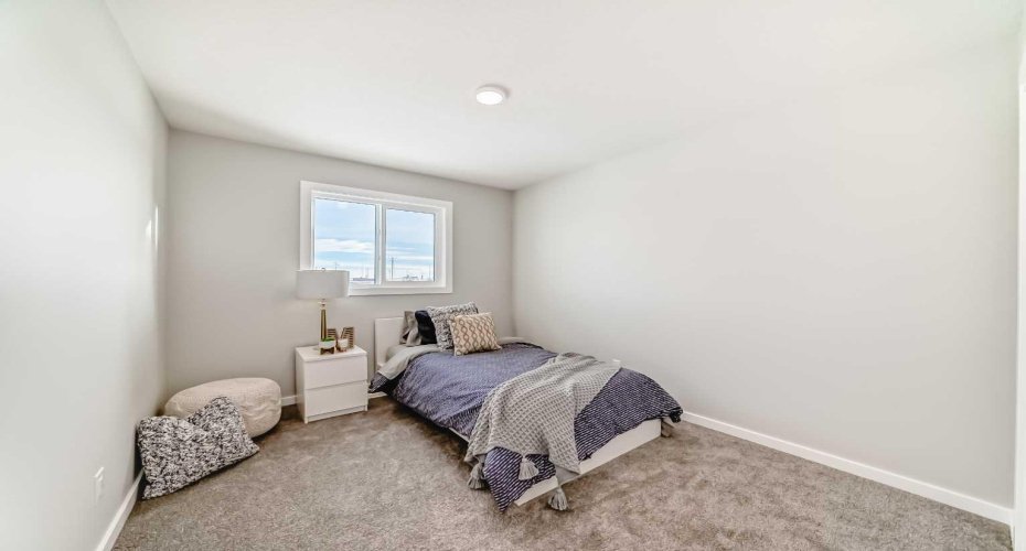 Upper Floor Bedroom Two • PLEASE NOTE: Photos are of a DIFFERENT Spec Home of the same model – fit and finish may differ. Interior selections and floorplans shown in photos.