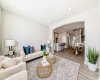 Living Room with Fireplace Feature Wall • PLEASE NOTE: Photos are of a DIFFERENT Spec Home of the same model – fit and finish may differ. Interior selections and floorplans shown in photos.