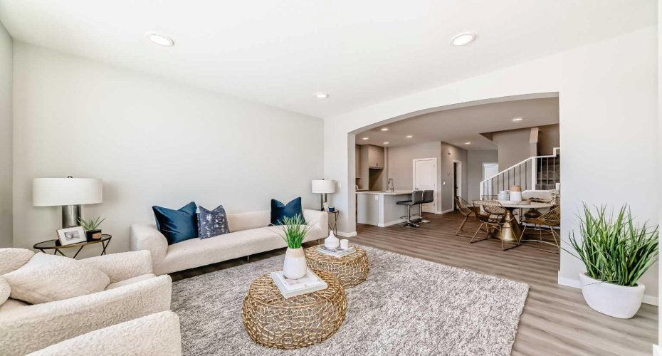 Living Room with Fireplace Feature Wall • PLEASE NOTE: Photos are of a DIFFERENT Spec Home of the same model – fit and finish may differ. Interior selections and floorplans shown in photos.