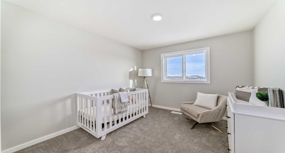 Upper Floor Bedroom Three • PLEASE NOTE: Photos are of a DIFFERENT Spec Home of the same model – fit and finish may differ. Interior selections and floorplans shown in photos.