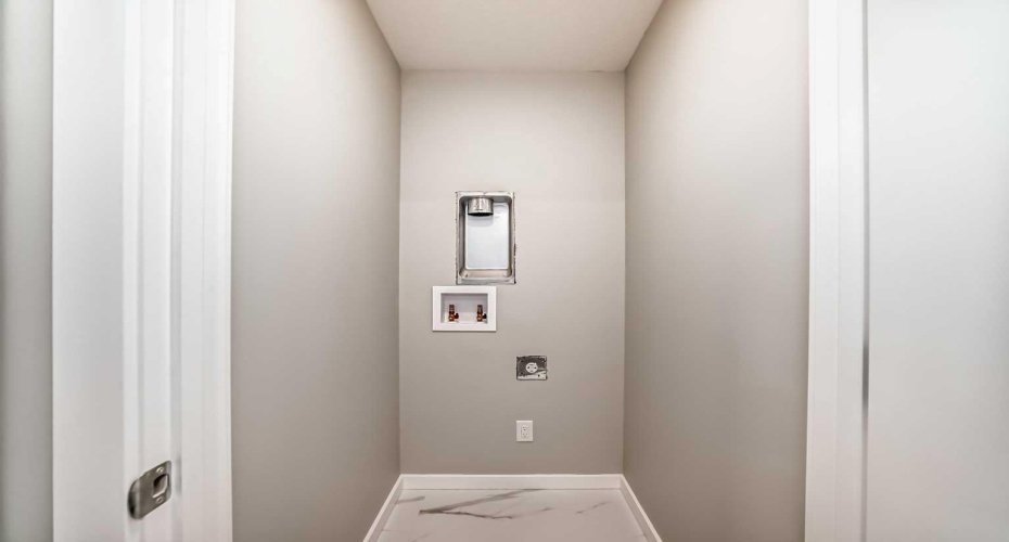 Upper Floor Laundry • PLEASE NOTE: Photos are of a DIFFERENT Spec Home of the same model – fit and finish may differ. Interior selections and floorplans shown in photos.