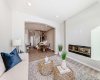 Living Room with Fireplace Feature Wall • PLEASE NOTE: Photos are of a DIFFERENT Spec Home of the same model – fit and finish may differ. Interior selections and floorplans shown in photos.
