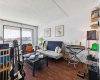 Large living area is bathed in natural light via large South facing windows.