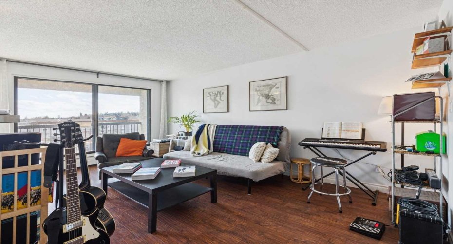 Large living area is bathed in natural light via large South facing windows.
