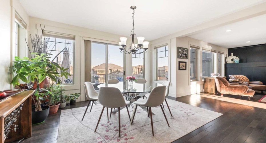 Dining area opens to the deck, creating a larger space for summer gatherings...