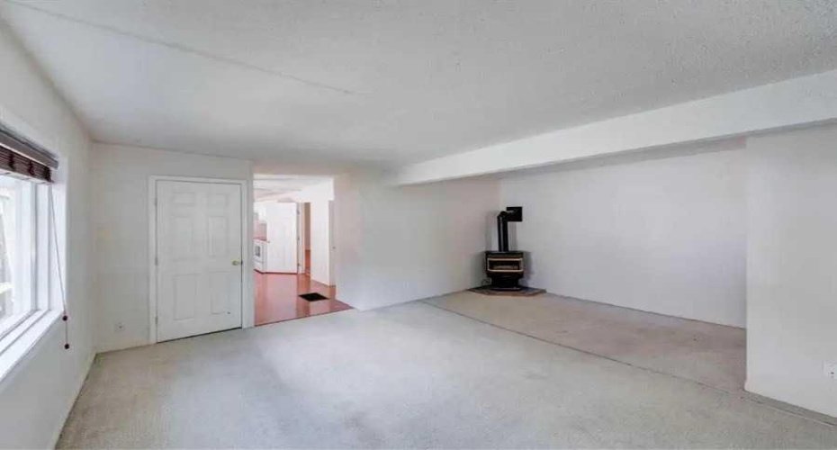 Gas wood stove adds warmth to the living room.