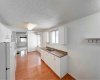 Easy flowing kitchen runs from living room through to the back of the house.