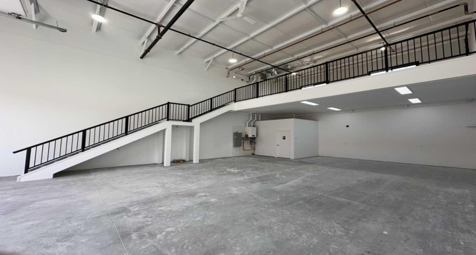 Mid construction with mezzanine and stairs in