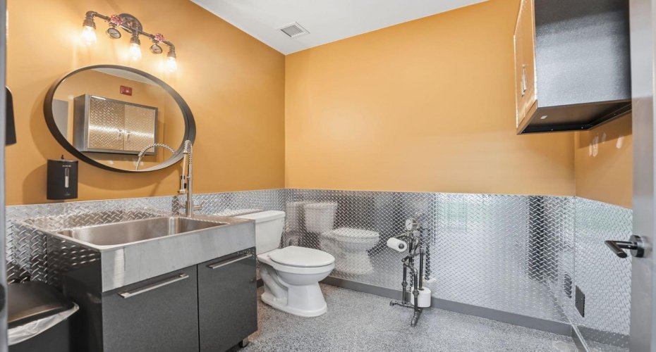 Plumbing rough-ins ready for a bathroom or shop sink.