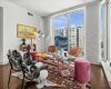 Nearly 900 square feet spread across a smart corner layout with hardwood floors and city views on two sides. The space lives larger than the number suggests.