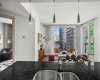 Standing at the kitchen island, you can see straight through to the living room and the windows beyond. The open flow between spaces is one of the things that makes the floor plan work so well day to day.