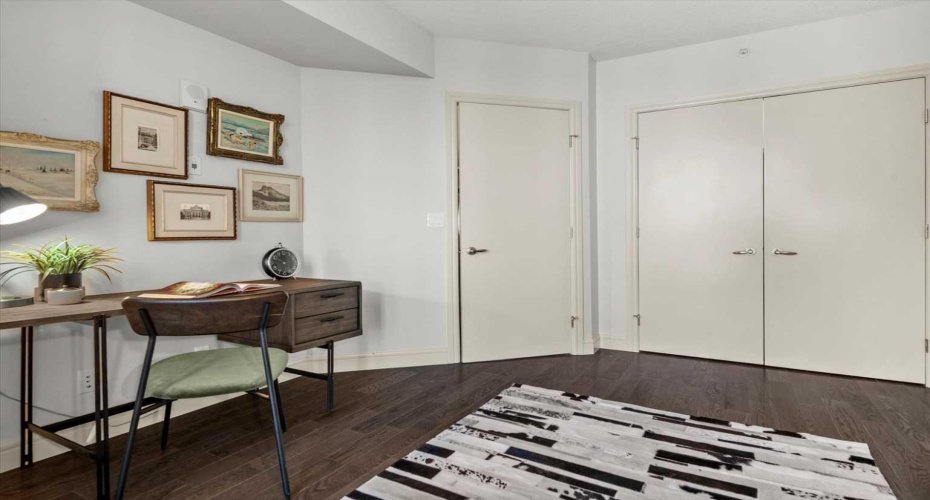 Looking back toward the closet and entry of the second bedroom, the room shows good proportions with real storage and a layout that adapts to whatever you need it to be.