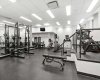 A second angle of the fitness centre shows the full weight rack, Smith machine, and Peloton bike. For a building amenity, it is genuinely well equipped and reflects the level of care that goes into maintaining The Montana.