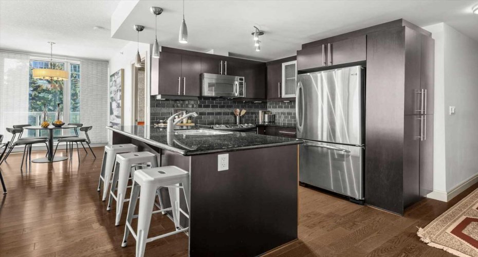 Pull up a stool at the granite island for your morning coffee or set out some appetizers before heading to 17th Ave for the evening. This kitchen earns its keep socially.
