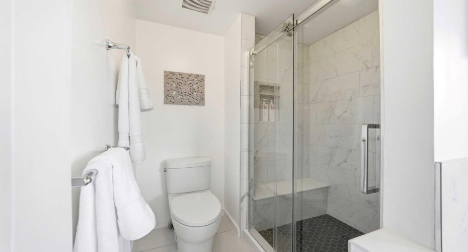 A newly completed, spacious shower with a sleek, modern design.