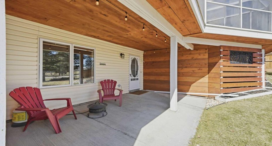 A beautifully appointed covered patio offering privacy and relaxation.