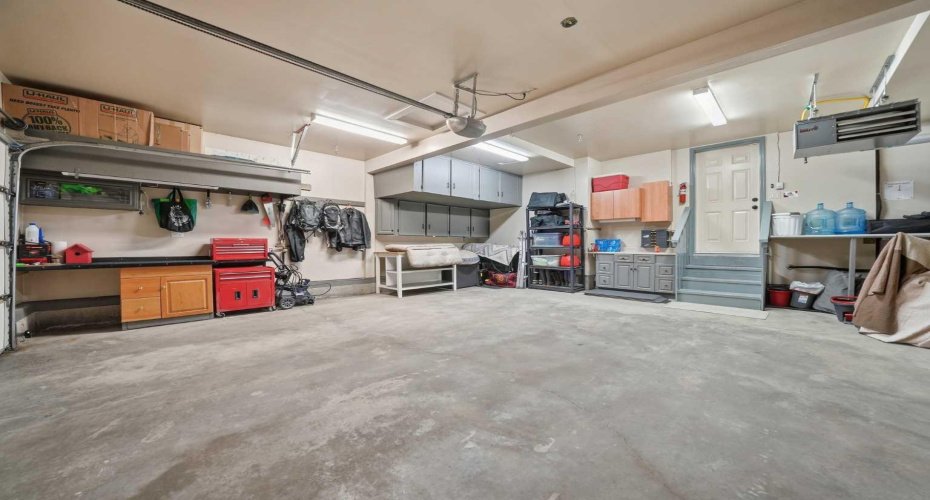 Heated Double Attached Garage with Storage and Workbenches