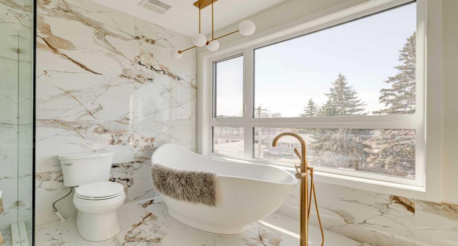 Modern Freestanding Soaker Tub with Statement Fixtures