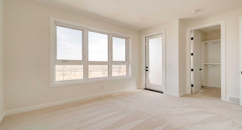 Second Floor Primary Bedroom with Private Balcony and Park Views