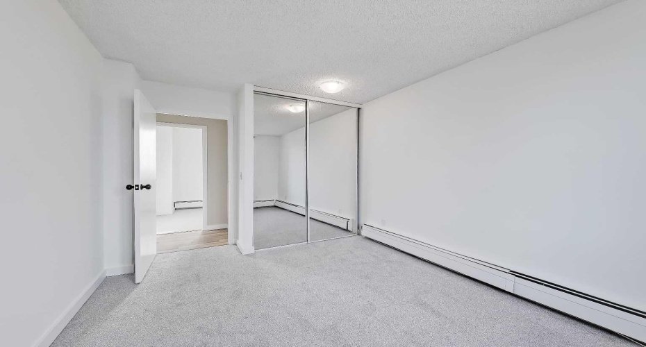 Primary bedroom with new paint and updated carpet