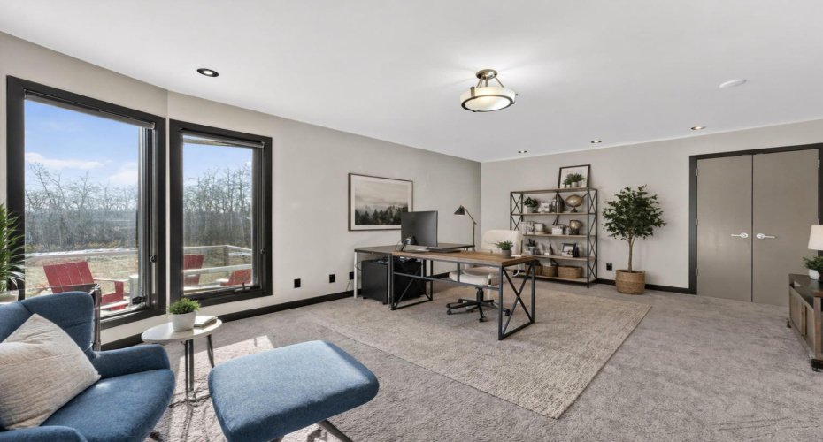 Main floor office that would function as a great additional bedroom if needed.  This image has been digitally staged/altered.