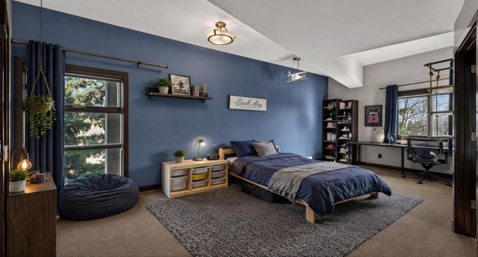 Upper level bedroom #2. This image has been digitally staged/altered.