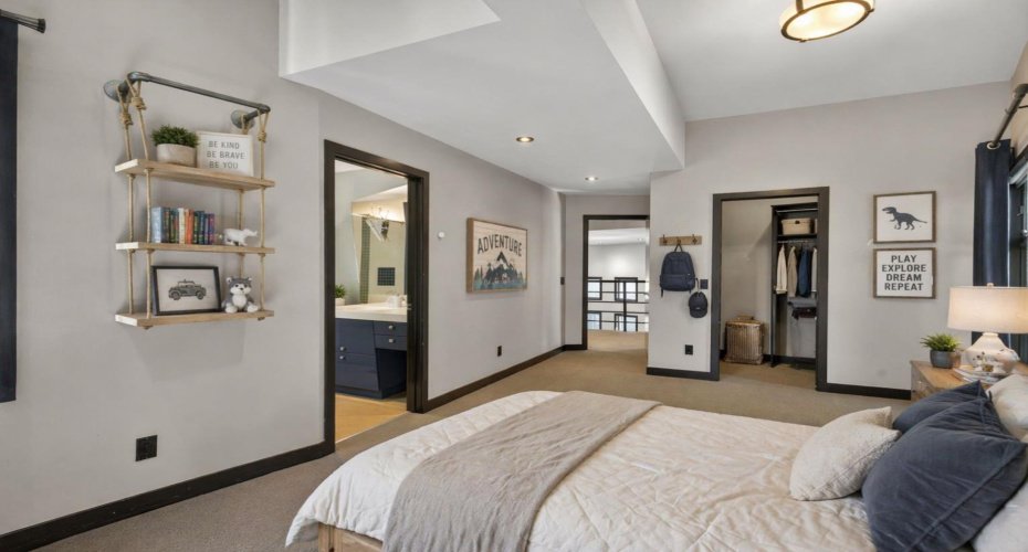 Upper level bedroom #3. This image has been digitally staged/altered.