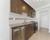 The kitchen features granite countertops, a large pantry, a central island, and ample cabinetry...
