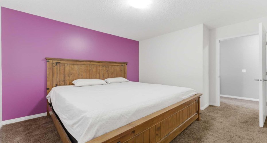 One of the three bedrooms located on the upper level