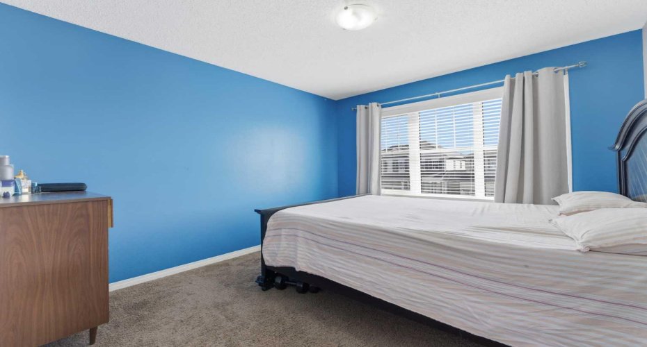 One of the three bedrooms located on the upper level