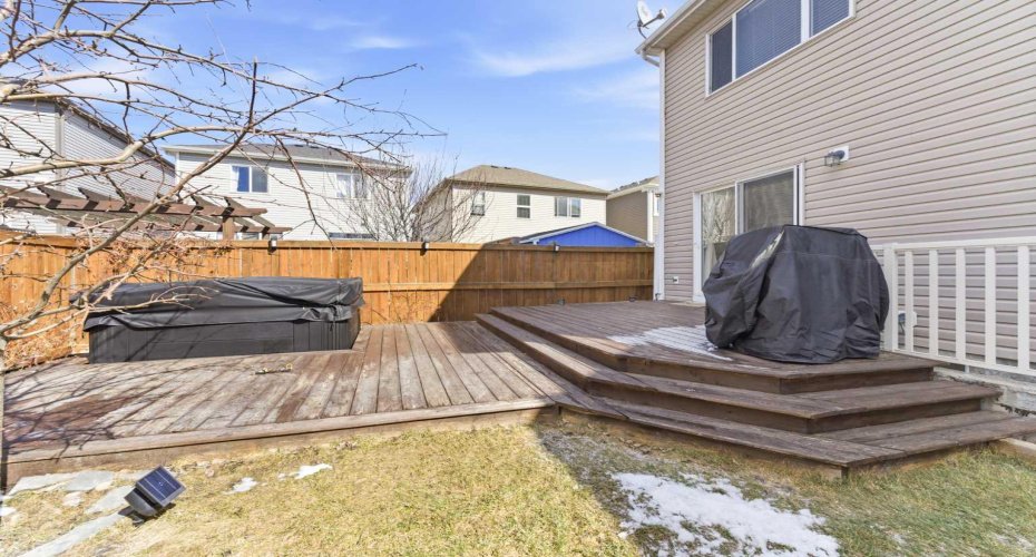 Backyard along with hot tub and two gas connections