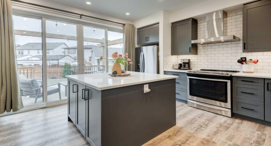 Upgraded patio sliding doors provide one of two access points to the huge yard. Lots od natural light thoughout this main floor!