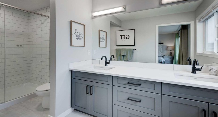 Ensuite with dual sinks and fully tiled walk-in shower