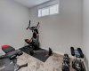 Basement bedroom that currently is being used for a gym