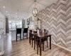 Dining area with trendy wall paper wall