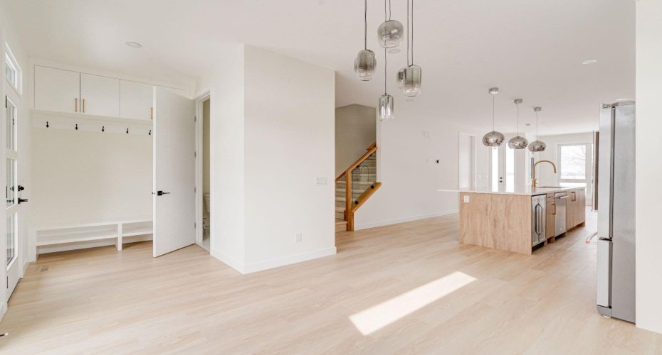 Back Entry with Custom Cabinetry and Access to Powder Room